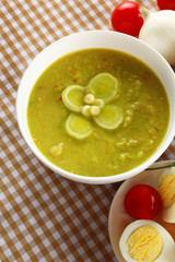 Leek soup on table, close up
