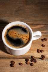 Cup of coffee on wooden background