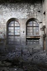 Fototapeta na wymiar walled up windows in an abandoned factory