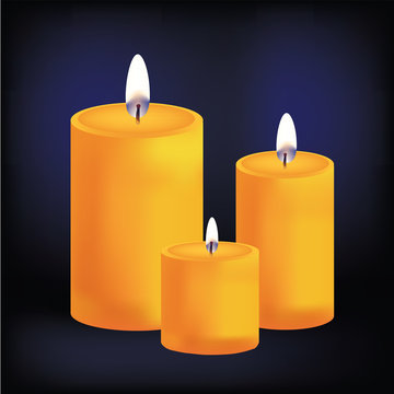 Realistic three yellow candles