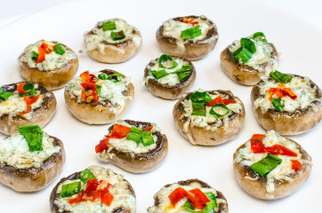 Baked muhrooms with blue cheese, red pepper and spring onion