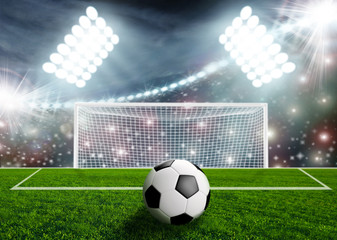 Soccer ball on green stadium arena