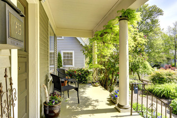 House column entrance porch with chairs
