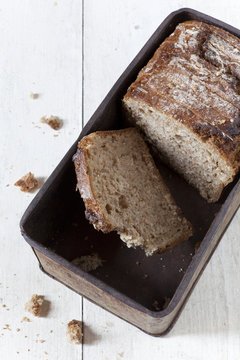 wholemeal sliced bread on vintage box on white table
