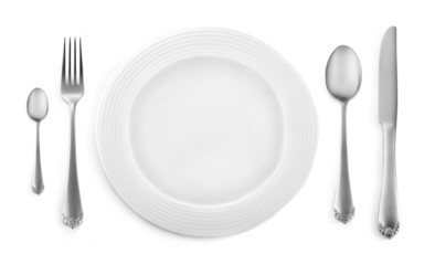 Empty plate with fork, knife and spoon