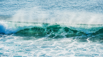 swirled blue colored ocean wave