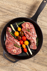 Lamb Chops with cherry tomato. Selective focus.
