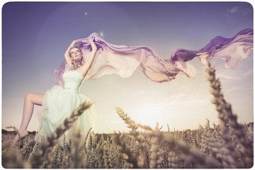 Beautiful woman dancing in the sundown