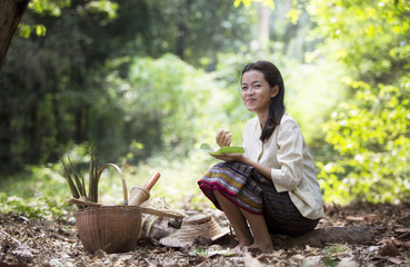 Asian woman working in the rainforest
