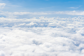 Clouds and sky, aerial view from airplane window.