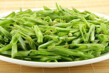 Beans slices in white plate.