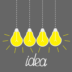 Hanging yellow light bulbs. Idea concept. Grey Flat 