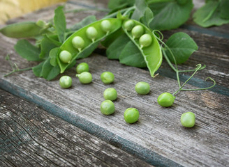 Peas on wooden board