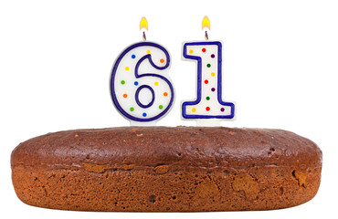 birthday cake with candles number sixty one isolated on white