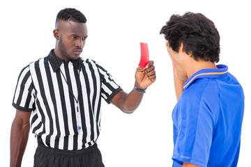 Referee sending off football player