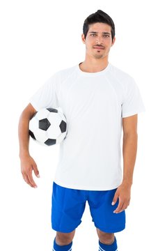 Football player in white holding ball
