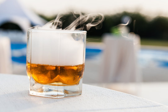 Whisky Glass With Pool On Background