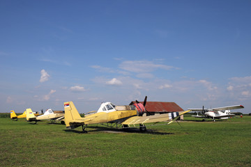 old crop duster airplanes on airfield