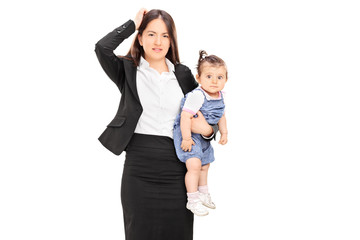 Young mother holding her baby daughter