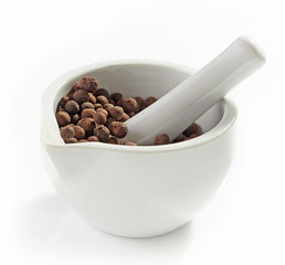 Aromatic black peppers in a mortar and pestle