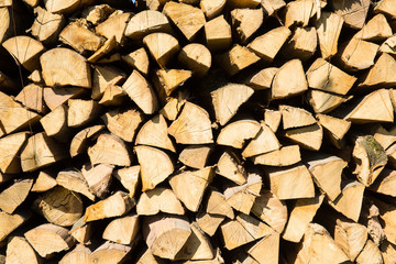 Pile of chopped firewood prepared for winter