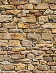 Colorful stone wall closeup in sunny day