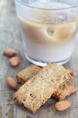 Almonds cookies and cup of milk tea