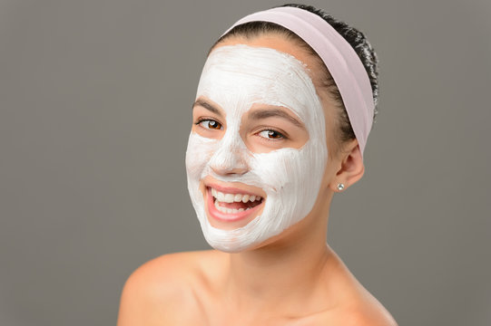 Smiling teenage girl face mask bare shoulders