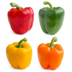 Red, yellow, orange and green peppers on white background.