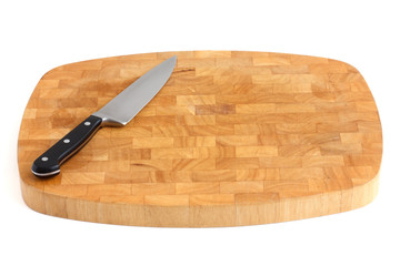 Traditional thick chopping board with a cooks knife.