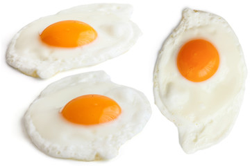 Collage of fried eggs on white. Different angles.