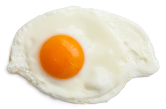 Single fried egg isolated on white from above. Clipping path.