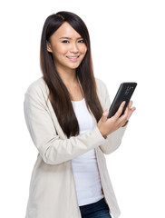 Asia young woman texting with mobile phone on white background