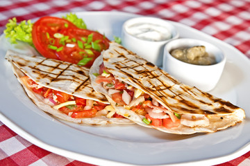 Barbecue chicken and cheddar quesadillas