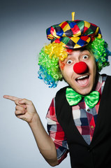 Funny clown against the dark background