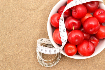 red plums and tape measure