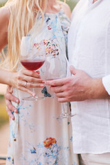 Couple drinking wine in cafe in the city