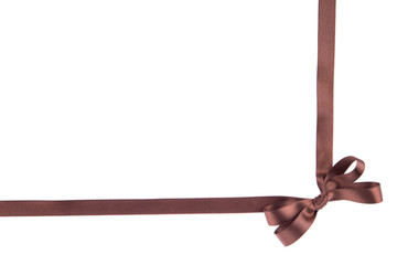 Brown ribbon with a bow on  white background
