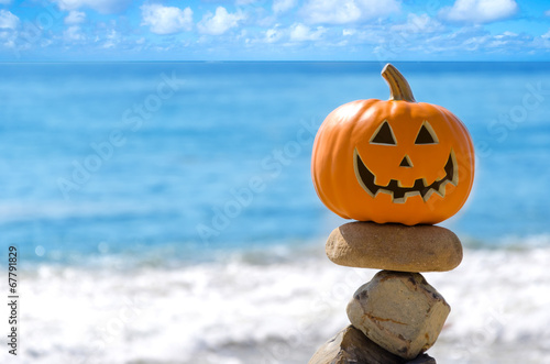 Halloween pumpkin on the beach