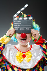 Clown with the movie board