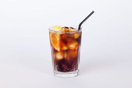 cola cocktail with lemon and ice