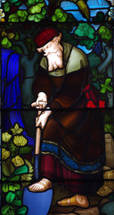 Man working in the garden. A stained glass window