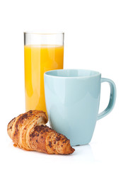 Cup of coffee, orange juice and fresh croissant
