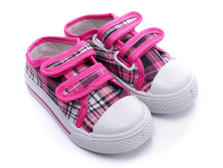 Pink sneakers for a baby on white background - obrazy, fototapety, plakaty