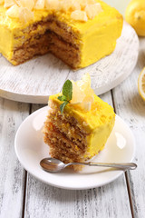 Tasty lemon dessert on wooden table