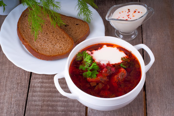 Borsch, soup from a beet, meat and cabbage with tomato sauce