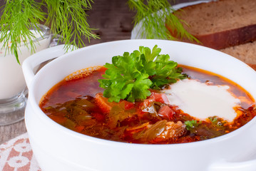 Borsch, soup from a beet, meat and cabbage with tomato sauce