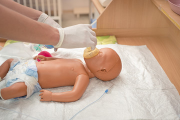 newborn resuscitation on a mannequin