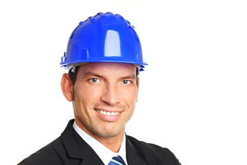 Portrait of handsome businessman in a protective helmet