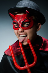 Funny devil against dark background